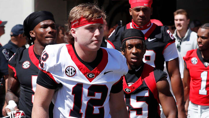 Georgia quarterback Ryan Puglisi (12) arrives with the team before the start of the G-Day spring football game in Athens, Ga., on Saturday, April 13, 2024. Georgia quarterback Ryan Puglisi (12) arrives with the team before the start of the G-Day spring football game in Athens, Ga., on Saturday, April 13, 2024.