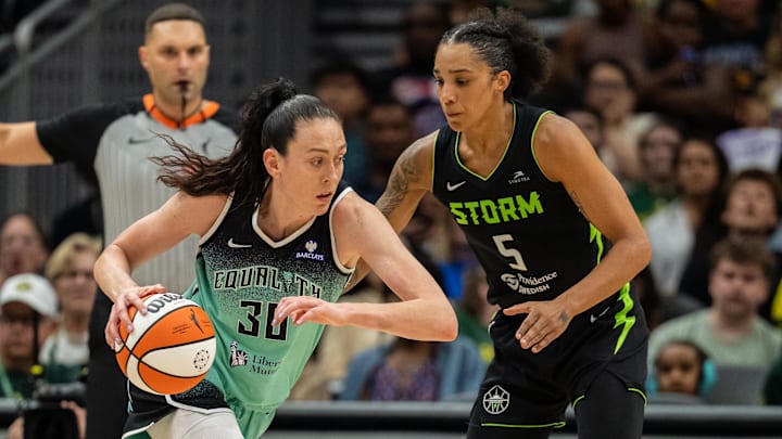 Sep 5, 2025; Seattle, Washington, USA;  New York Liberty forward Breanna Stewart (30) dribbles the ball against Seattle Storm forward Gabby Williams (5) during the second half at Climate Pledge Arena. Mandatory Credit: Stephen Brashear-Imagn Images