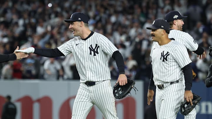 Oct 2, 2025; Bronx, New York, USA; New York Yankees catcher Austin Wells (28) and outfielder Cody Bellinger (35) shake hands following game three of the Wildcard round for the 2025 MLB playoffs against the Boston Red Sox at Yankee Stadium. Mandatory Credit: Vincent Carchietta-Imagn Images