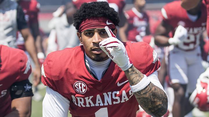 Arkansas Razorbacks defensive back Christian Harrison (1) kneels before the start of the spring game at Razorback Stadium.