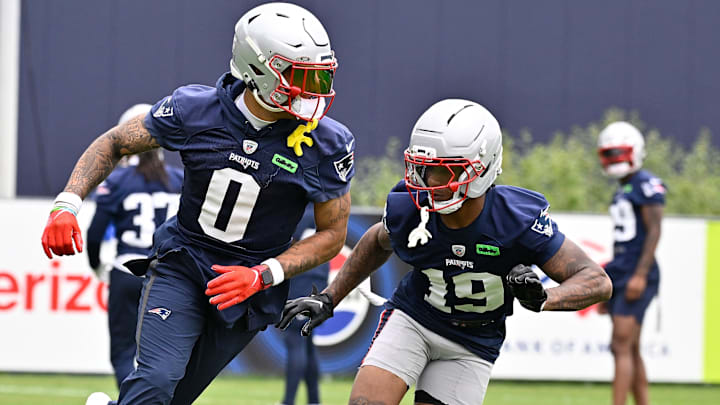 Jun 9, 2025; Foxborough, MA, USA; New England Patriots cornerback Christian Gonzalez (0) and cornerback Kobee Minor (19) run a drill during minicamp at Gillette Stadium. Mandatory Credit: Eric Canha-Imagn Images