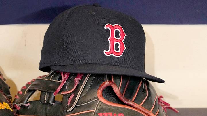 May 27, 2025; Milwaukee, Wisconsin, USA; A Boston Red Sox hat and glove sit in the dug out before a game against the Milwaukee Brewers at American Family Field. May 27, 2025; Milwaukee, Wisconsin, USA; A Boston Red Sox hat and glove sit in the dug out before a game against the Milwaukee Brewers at American Family Field.