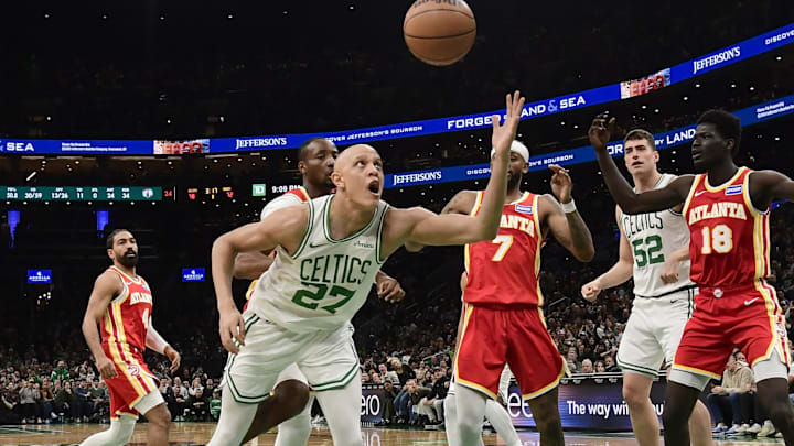 Mar 27, 2026; Boston, Massachusetts, USA; Boston Celtics guard Jordan Walsh (27) tries to gain control of the ball in front of Atlanta Hawks guard Nickeil Alexander-Walker (7) and forward Mouhamed Gueye (18) during the second half at TD Garden. Mandatory Credit: Bob DeChiara-Imagn Images