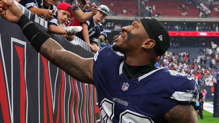 Dallas Cowboys safety Juanyeh Thomas (43) shakes hands with a fan after defeating the Houston Texans at Reliant Stadium. 