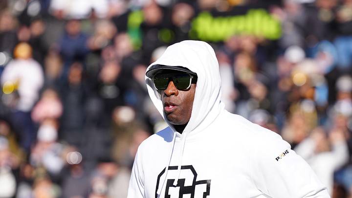 Nov 29, 2024; Boulder, Colorado, USA; Colorado Buffaloes head coach Deion Sanders runs onto the field before the game against the Oklahoma State Cowboys at Folsom Field.