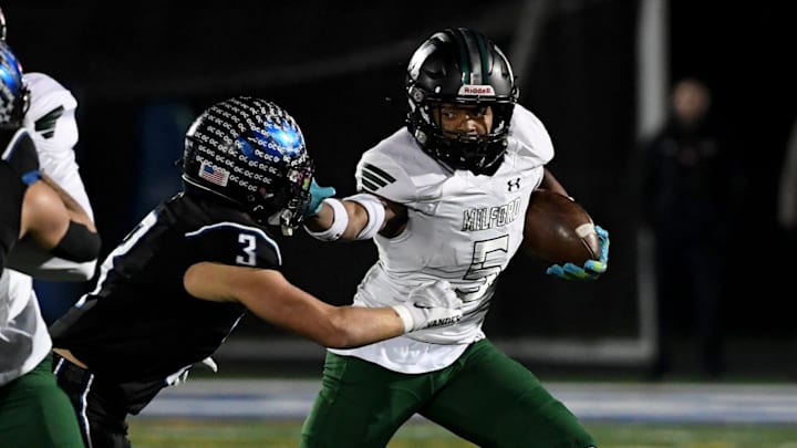 Decatur's Gavin Solito (3) tackles Milford Mill's Damon Ferguson (5) Friday, Nov. 24, 2023, in the 2A State Semifinal in Berlin, Maryland. Decatur defeated Milford Mill 35-34. Decatur's Gavin Solito (3) tackles Milford Mill's Damon Ferguson (5) Friday, Nov. 24, 2023, in the 2A State Semifinal in Berlin, Maryland. Decatur defeated Milford Mill 35-34.