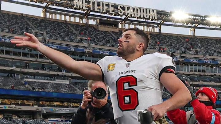 Nov 24, 2024; East Rutherford, New Jersey, USA; Tampa Bay Buccaneers quarterback Baker Mayfield (6) throws his towel to a fan after the game against the New York Giants at MetLife Stadium. Mandatory Credit: Vincent Carchietta-Imagn Images