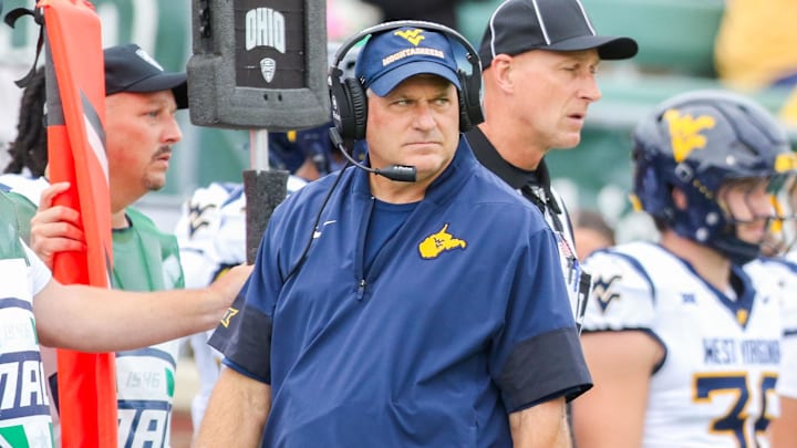 Sep 6, 2025; Athens, Ohio, USA; West Virginia Mountaineers head coach Rich Rodriguez walks along the sidelines during the first quarter against the Ohio Bobcats at Peden Stadium. Mandatory Credit: Ben Queen-Imagn Images