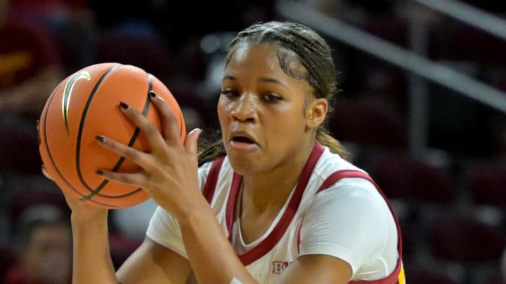 Dec 2, 2025; Los Angeles, California, USA;  Saint Mary's Gaels guard Malia Latu (13) defends USC Trojans guard Kara Dunn (25) during the first half at Galen Center. Mandatory Credit: Jayne Kamin-Oncea-Imagn Images