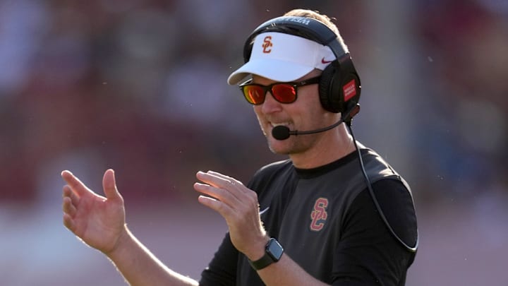 Aug 30, 2025; Los Angeles, California, USA; Southern California Trojans head coach Lincoln Riley watches from the sidelines against the Missouri State Bears in the first half at United Airlines Field at Los Angeles Memorial Coliseum. Mandatory Credit: Kirby Lee-Imagn Images