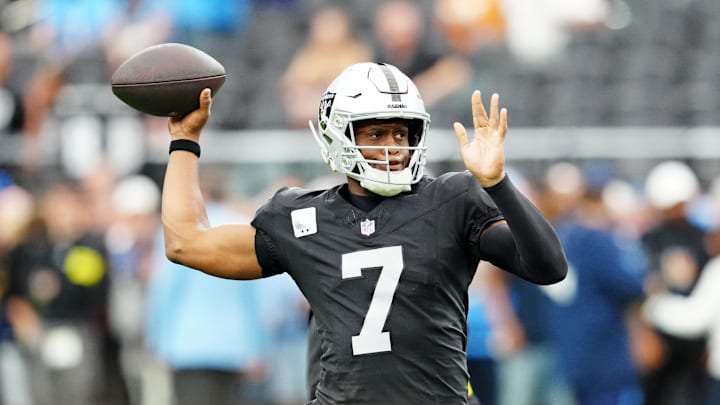 Oct 12, 2025; Paradise, Nevada, USA; Las Vegas Raiders quarterback Geno Smith (7) warms up before the game against the Tennessee Titans at Allegiant Stadium. Mandatory Credit: Stephen R. Sylvanie-Imagn Images