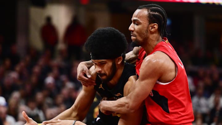 May 3, 2026; Cleveland, Ohio, USA; Toronto Raptors guard A.J. Lawson (0) fouls Cleveland Cavaliers center Jarrett Allen (31) during the first half of game seven in the first round of the 2026 NBA Playoffs at Rocket Arena. Mandatory Credit: Ken Blaze-Imagn Images
