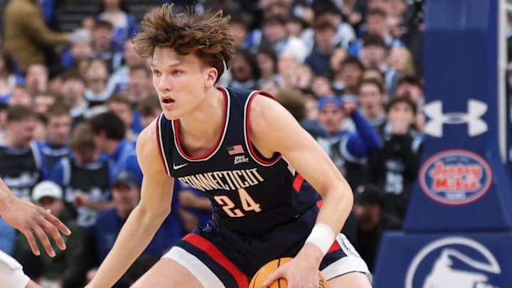 Jan 13, 2026; Newark, New Jersey, USA; UConn Huskies guard Braylon Mullins (24) is guarded by UConn Huskies forward Jayden Ross (23) during the first half at Prudential Center. Mandatory Credit: Vincent Carchietta-Imagn Images