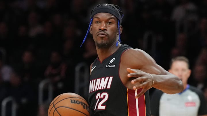 Dec 4, 2024; Miami, Florida, USA;  Miami Heat forward Jimmy Butler (22) dribbles against the Los Angeles Lakers in during the first half at Kaseya Center. Mandatory Credit: Jim Rassol-Imagn Images