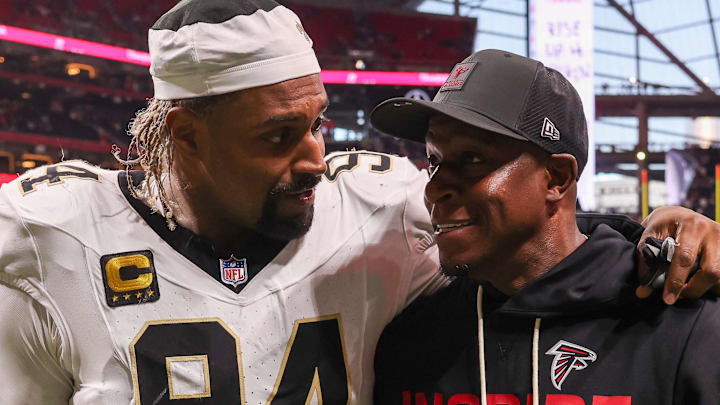 Jan 4, 2026; Atlanta, Georgia, USA; New Orleans Saints defensive end Cameron Jordan (94) walks with Atlanta Falcons head coach Raheem Morris after a game at Mercedes-Benz Stadium. Mandatory Credit: Brett Davis-Imagn Images