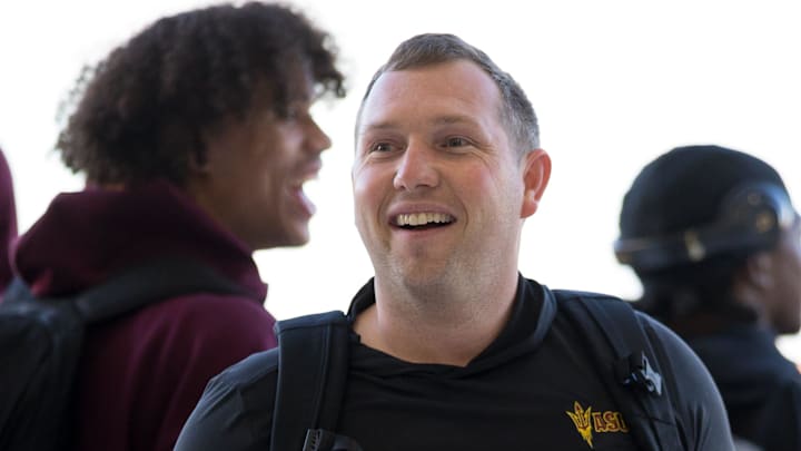 Arizona State head football coach Kenny Dillingham watches folklórico dancers perform as they arrive at the Atlantic FBO Hangar in El Paso, Texas, on Saturday, Dec. 27, 2025, ahead of the Tony the Tiger Sun Bowl.