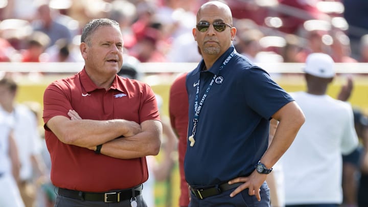 Arkansas head coach Sam Pittman and Penn State coach James Franklin talk before the game during the 2022 Outback Bowl at Raymond James Stadium. Arkansas head coach Sam Pittman and Penn State coach James Franklin talk before the game during the 2022 Outback Bowl at Raymond James Stadium.