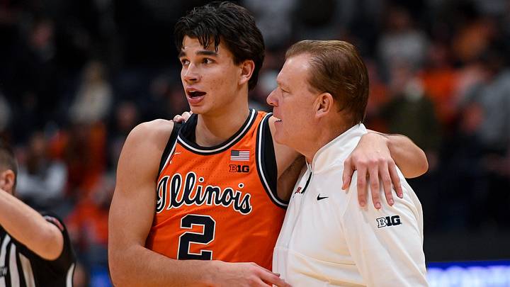 Dec 6, 2025; Nashville, Tennessee, USA;  Illinois Fighting Illini guard Andrej Stojakovic (2) celebrates the win with head coach Brad Underwood against the Tennessee Volunteers during the second half at Bridgestone Arena. Mandatory Credit: Steve Roberts-Imagn Images