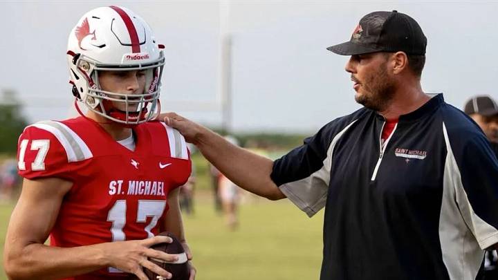 Gunner Rivers gets coached up by his father former Colts quarterback, Philip Rivers. Gunner Rivers gets coached up by his father former Colts quarterback, Philip Rivers.