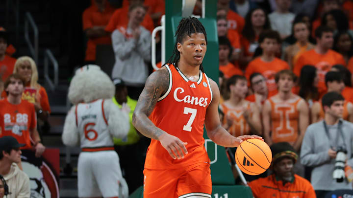 Feb 10, 2026; Coral Gables, Florida, USA; Miami Hurricanes forward Shelton Henderson (7) dribbles the basketball against the North Carolina Tar Heels during the first half at Watsco Center. Mandatory Credit: Sam Navarro-Imagn Images