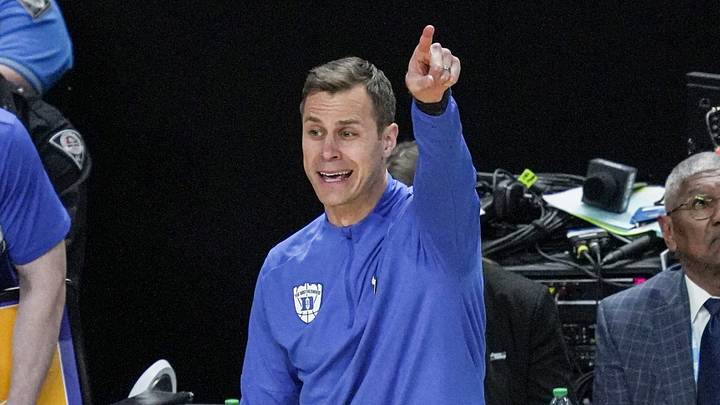 TCU Horned Frogs guard Brock Harding (2) passes near Duke Blue Devils head coach Jon Scheyer March 21, 2026 during the NCAA Men’s Basketball Tournament second round East Region game at the Bon Secours Wellness Arena in Greenville, South Carolina.