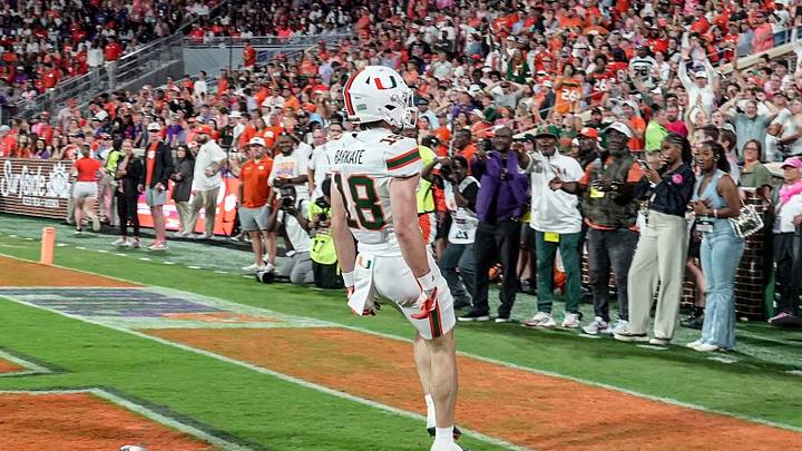 Miami Hurricanes wide receiver Cooper Barkate (18) left the ball on the ground and celebrated with fans after he scored against Clemson during the first quarter at Memorial Stadium Saturday, October 3, 2026. Miami Hurricanes wide receiver Cooper Barkate (18) left the ball on the ground and celebrated with fans after he scored against Clemson during the first quarter at Memorial Stadium Saturday, October 3, 2026.