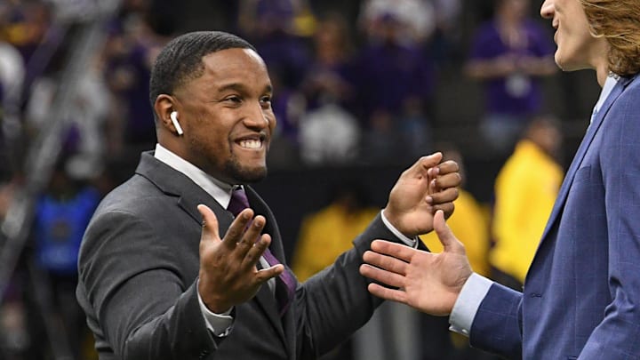 Xavier Brewer, left, and quarterback Trevor Lawrence greet each other before of the College Football Playoff National Championship game in New Orleans Monday, January 13, 2020.
