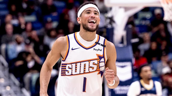 Dec 5, 2024; New Orleans, Louisiana, USA;  Phoenix Suns guard Devin Booker (1) reacts to having foul called against him against the New Orleans Pelicans during the second half  at Smoothie King Center. Mandatory Credit: Stephen Lew-Imagn Images