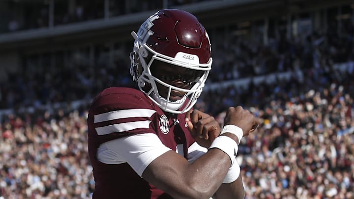 Mississippi State Bulldogs quarterback Kamario Taylor (1) celebrates after scoring a touchdown against the Mississippi Rebels in the first half at Davis Wade Stadium at Scott Field.
