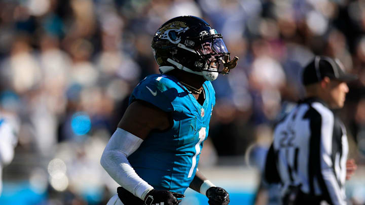 Jacksonville Jaguars running back Travis Etienne Jr. (1) runs to the sideline after scoring a touchdown during the third quarter of a regular season NFL football matchup Sunday, Dec. 31, 2023 at EverBank Stadium in Jacksonville, Fla. The Jacksonville Jaguars blanked the Carolina Panthers 26-0. [Corey Perrine/Florida Times-Union]