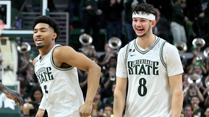 Jan 19, 2025; East Lansing, Michigan, USA; Michigan State Spartans guard Jaden Akins (3) and forward Frankie Fidler (8) celebrate as the clock expires and the Michigan State Spartans defeat the Illinois Fighting Illini at Jack Breslin Student Events Center. Mandatory Credit: Dale Young-Imagn Images Jan 19, 2025; East Lansing, Michigan, USA; Michigan State Spartans guard Jaden Akins (3) and forward Frankie Fidler (8) celebrate as the clock expires and the Michigan State Spartans defeat the Illinois Fighting Illini at Jack Breslin Student Events Center. Mandatory Credit: Dale Young-Imagn Images