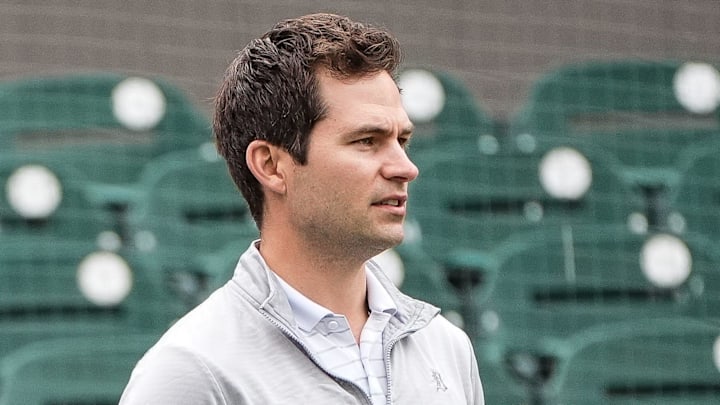 Detroit Tigers team owner Chris Ilitch, left, talks to president of baseball operation Scott Harris as they watch batting practice during spring training at Joker Marchant Stadium in Lakeland, Fla. on Thursday, Feb. 20, 2025.