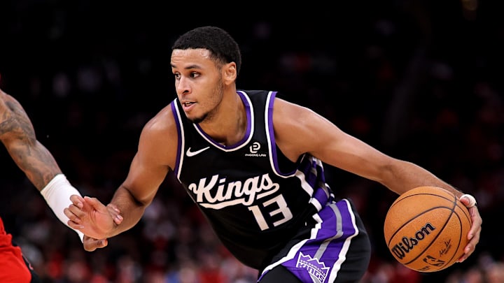 Dec 3, 2025; Houston, Texas, USA; Sacramento Kings forward Keegan Murray (13) drives to the basket against Houston Rockets forward Jabari Smith Jr. (10) during the third quarter at Toyota Center.