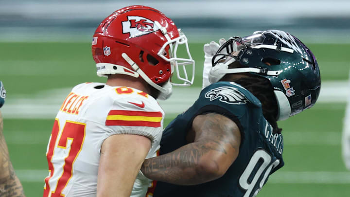 Feb 9, 2025; New Orleans, LA, USA; Kansas City Chiefs tight end Travis Kelce (87) bumps into Philadelphia Eagles defensive tackle Jalen Carter (98) in the fourth quarter  in Super Bowl LIX at Ceasars Superdome. Mandatory Credit: Stephen Lew-Imagn Images