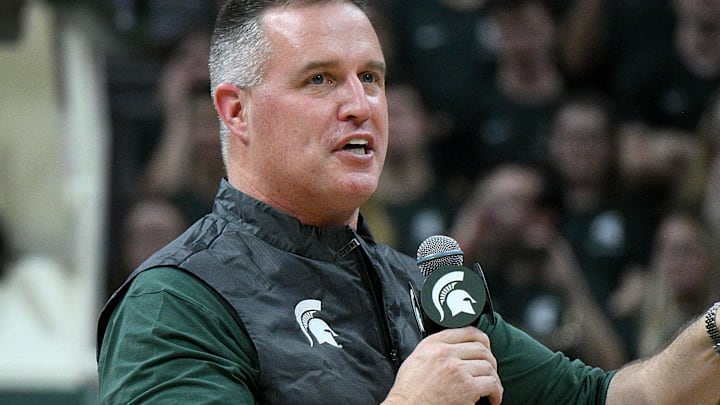 Dec 2, 2025; East Lansing, Michigan, USA;  Michigan State head football coach Pat Fitzgerald watches the Spartans defeat the Iowa Hawkeyes at Jack Breslin Student Events Center. Mandatory Credit: Dale Young-Imagn Images