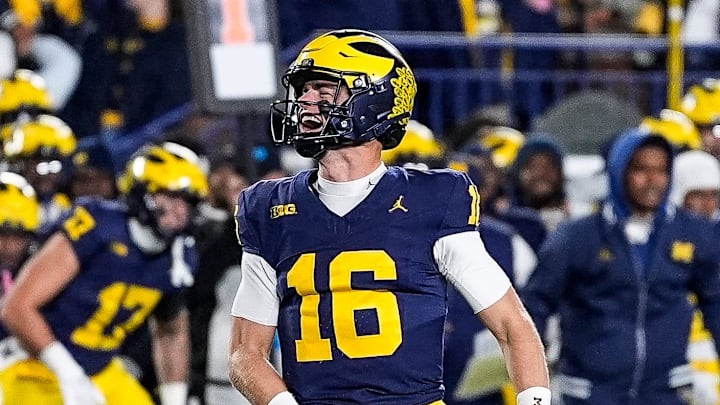 Michigan quarterback Davis Warren (16) celebrates as time expires in the 24-17 win over Michigan State at Michigan Stadium in Ann Arbor on Saturday, Oct. 26, 2024. Michigan quarterback Davis Warren (16) celebrates as time expires in the 24-17 win over Michigan State at Michigan Stadium in Ann Arbor on Saturday, Oct. 26, 2024.