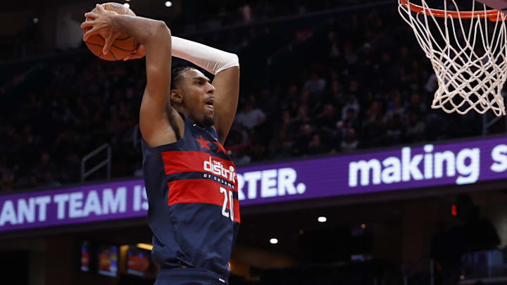 Nov 25, 2025; Washington, District of Columbia, USA; Washington Wizards center Alex Sarr (20) dunks the ball as Atlanta Hawks forward Zaccharie Risacher (10) looks on in the second half at Capital One Arena. Mandatory Credit: Geoff Burke-Imagn Images