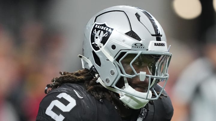 Jan 4, 2026; Paradise, Nevada, USA; Las Vegas Raiders running back Ashton Jeanty (2) carries the ball against the Kansas City Chiefs in the first half at Allegiant Stadium. Mandatory Credit: Kirby Lee-Imagn Images