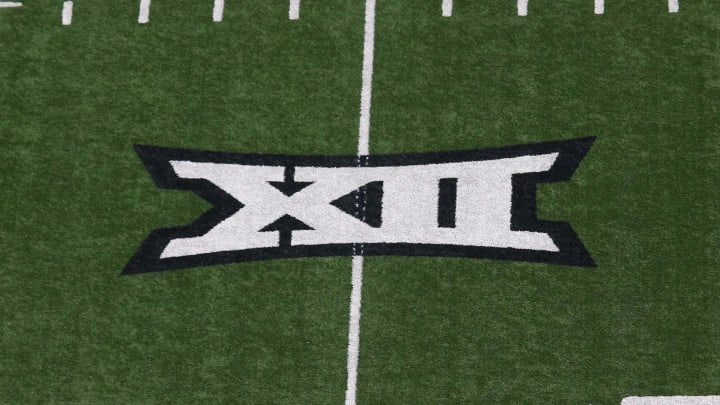 An image of the Big 12 Conference logo on the field during a college football game.