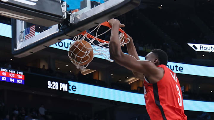 Oct 7, 2024; Salt Lake City, Utah, USA; Houston Rockets center N'Faly Dante (3) dunks against Utah Jazz forward Drew Eubanks (15) during the fourth quarter at Delta Center. Mandatory Credit: Rob Gray-Imagn Images Oct 7, 2024; Salt Lake City, Utah, USA; Houston Rockets center N'Faly Dante (3) dunks against Utah Jazz forward Drew Eubanks (15) during the fourth quarter at Delta Center. Mandatory Credit: Rob Gray-Imagn Images