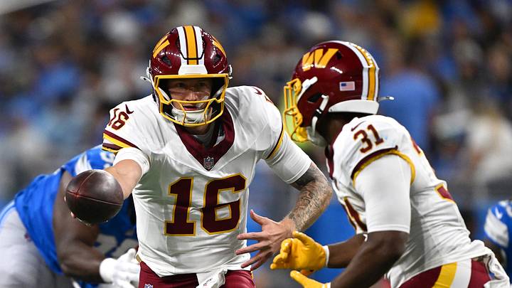 Aug 22, 2026; Detroit, Michigan, USA;  Washington Commanders quarterback Athan Kaliakmanis (16) hands the ball off to running back Kaytron Allen (31) against the Detroit Lions in the second quarter at Ford Field.  Mandatory Credit: Lon Horwedel-Imagn Images