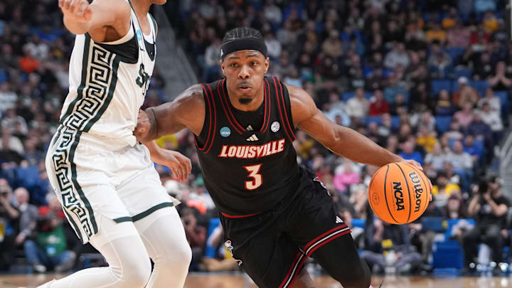 Mar 21, 2026; Buffalo, NY, USA; Louisville Cardinals guard Ryan Conwell (3) drives the ball during the first half against the Michigan State Spartans during a second round game of the men's 2026 NCAA Tournament at Keybank Center. Mandatory Credit: Gregory Fisher-Imagn Images