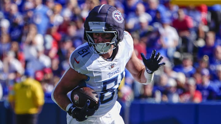 Oct 20, 2024; Orchard Park, New York, USA; Tennessee Titans tight end Josh Whyle (81) runs with the ball after making a catch against the Buffalo Bills during the first half at Highmark Stadium. Mandatory Credit: Gregory Fisher-Imagn Images Oct 20, 2024; Orchard Park, New York, USA; Tennessee Titans tight end Josh Whyle (81) runs with the ball after making a catch against the Buffalo Bills during the first half at Highmark Stadium. Mandatory Credit: Gregory Fisher-Imagn Images