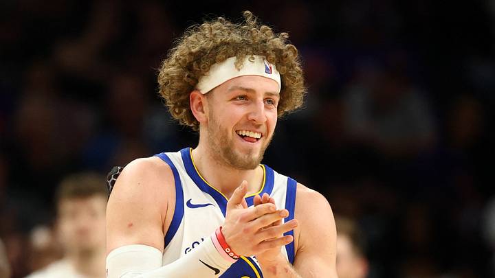 Apr 17, 2026; Phoenix, Arizona, USA; Golden State Warriors guard Brandin Podziemski (2) celebrates against the Phoenix Suns during the first half in the play-in rounds of the 2026 NBA Playoffs at Mortgage Matchup Center. Mandatory Credit: Mark J. Rebilas-Imagn Images