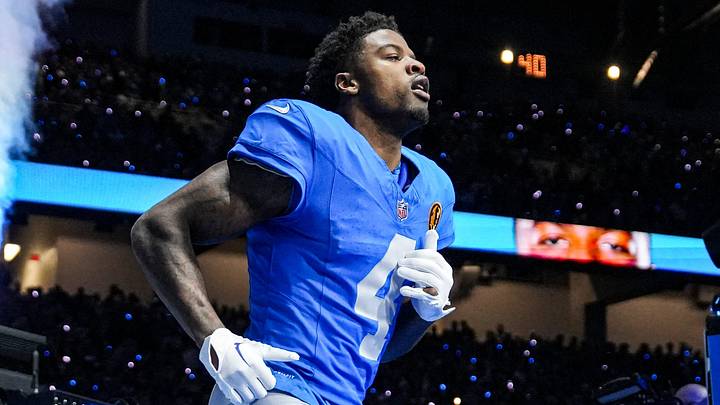 Detroit Lions cornerback D.J. Reed (4) runs onto the field for players introduction before the Thanksgiving game against Green Bay Packers at Ford Field in Detroit on Thursday, Nov. 27, 2025. Detroit Lions cornerback D.J. Reed (4) runs onto the field for players introduction before the Thanksgiving game against Green Bay Packers at Ford Field in Detroit on Thursday, Nov. 27, 2025.