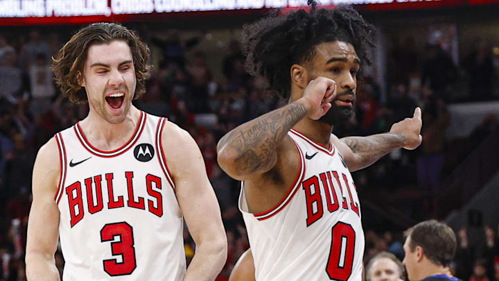 Nov 22, 2025; Chicago, Illinois, USA; Chicago Bulls guard Josh Giddey (3) and guard Coby White (0) celebrate a defensive stop against the Washington Wizards during the second half at United Center. Mandatory Credit: Kamil Krzaczynski-Imagn Images
