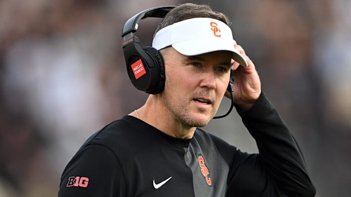 Sep 13, 2025; West Lafayette, Indiana, USA; Southern California Trojans head coach Lincoln Riley stands on the sidelines during the first quarter against the Purdue Boilermakers at Ross-Ade Stadium. Mandatory Credit: Marc Lebryk-Imagn Images Sep 13, 2025; West Lafayette, Indiana, USA; Southern California Trojans head coach Lincoln Riley stands on the sidelines during the first quarter against the Purdue Boilermakers at Ross-Ade Stadium. Mandatory Credit: Marc Lebryk-Imagn Images