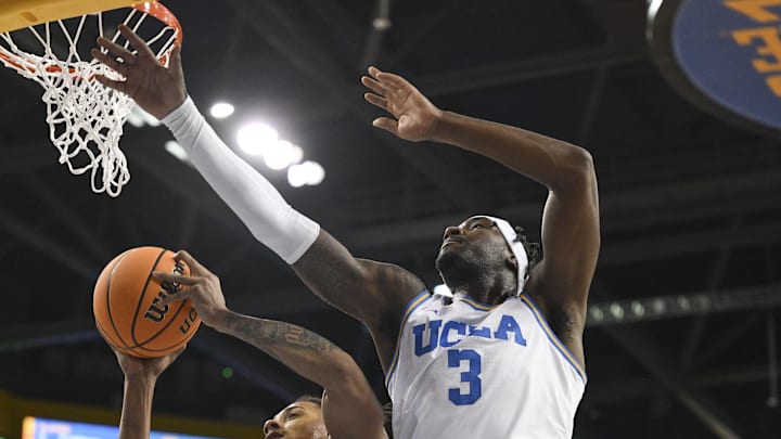 Feb 23, 2025; Los Angeles, California, USA; Ohio State Buckeyes forward Devin Royal (21) and UCLA Bruins guard Eric Dailey Jr. (3) reach for a rebound during the first quarter at Pauley Pavilion presented by Wescom. Mandatory Credit: Robert Hanashiro-Imagn Images Feb 23, 2025; Los Angeles, California, USA; Ohio State Buckeyes forward Devin Royal (21) and UCLA Bruins guard Eric Dailey Jr. (3) reach for a rebound during the first quarter at Pauley Pavilion presented by Wescom. Mandatory Credit: Robert Hanashiro-Imagn Images
