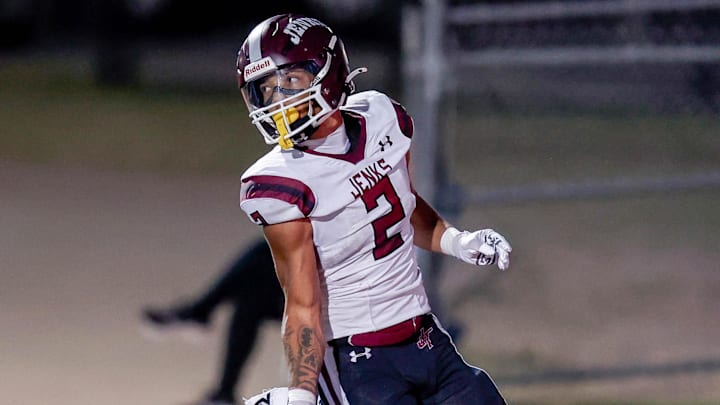 Jenks’ Kaydin Jones (2) runs the ball for a touchdown during a high school football game between Mustang and Jenks in Mustang, Okla., on Friday, Oct. 11, 2024.