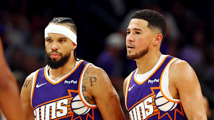 Phoenix Suns guard Devin Booker (1) and forward Dillon Brooks (3) during the second half against the Sacramento Kings at the Mortgage Matchup Center. Credit: Mark J. Rebilas-Imagn Images